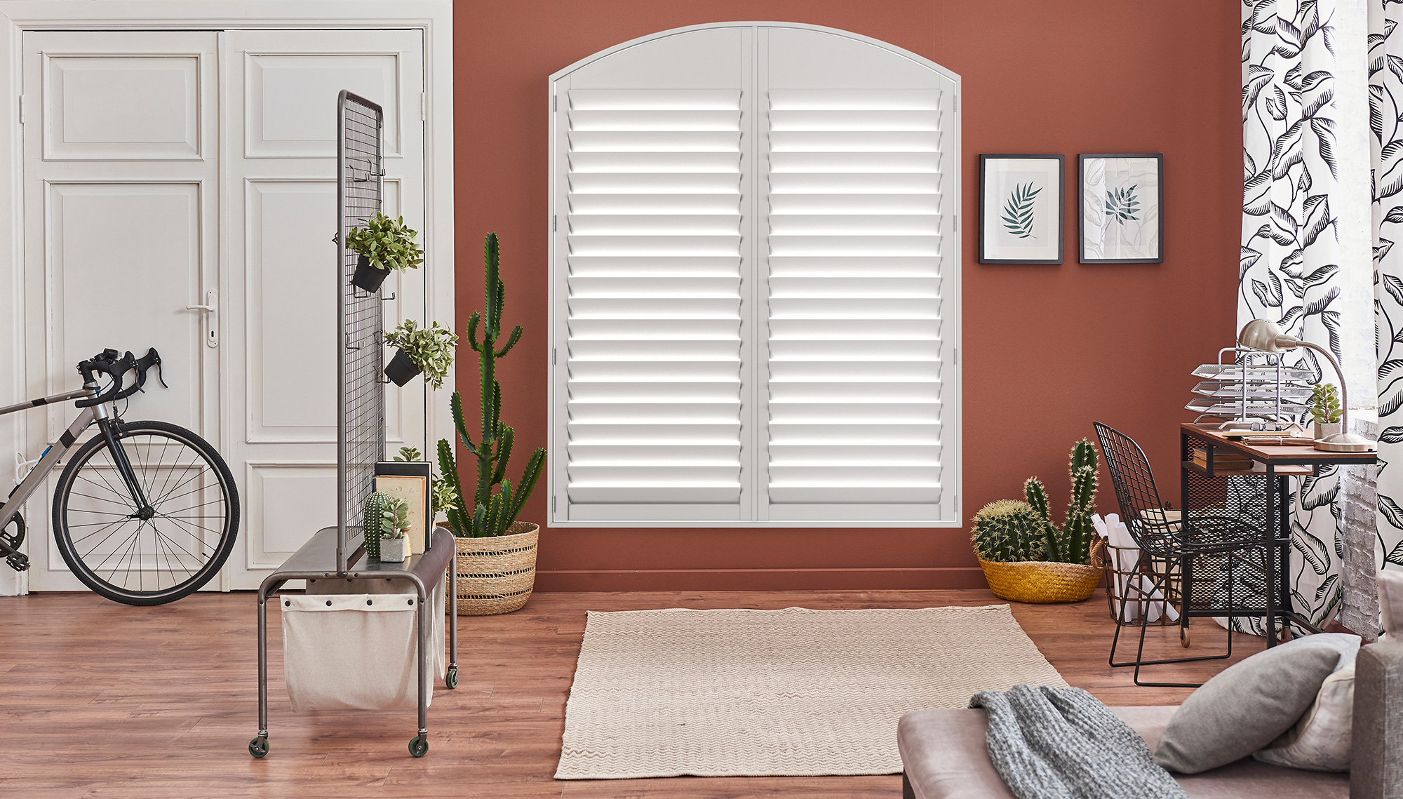 White window blinds with horizontal slats angled to allow partial light through.